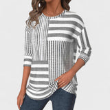 Olga - Blusa listrada de tecido respirável