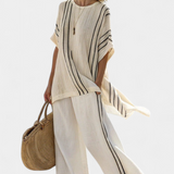 Sara – Blusa de linho elegante na cor marfim e calças pretas listradas